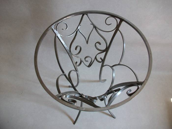 Wrought iron pedestal table.  Alain Segura