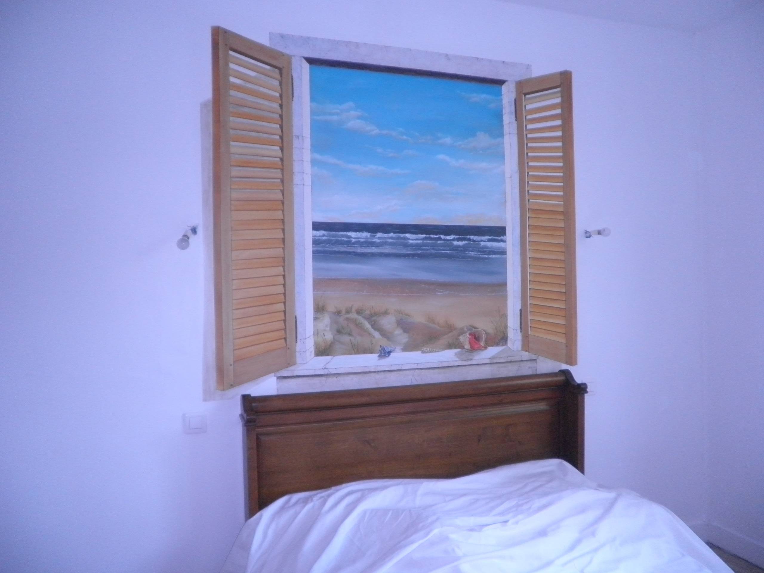 Trompé l’œil fenêtre sur la plage. 